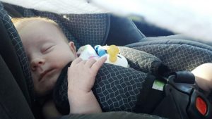 baby sleeping in car seat