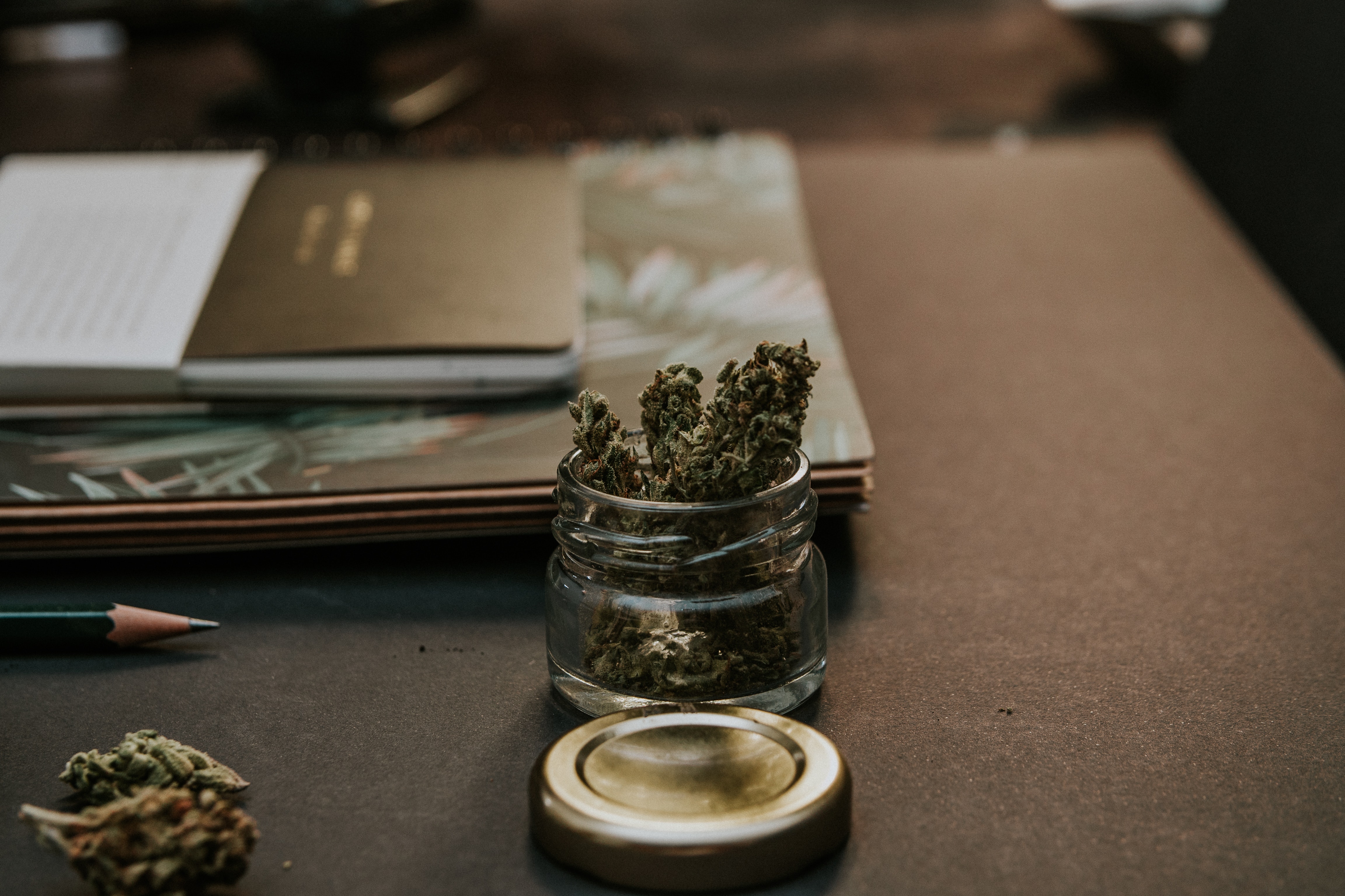 Picture of a glass jar filled with weed.