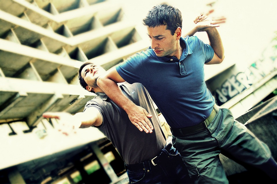 Man elbows another man in the face in self defense.