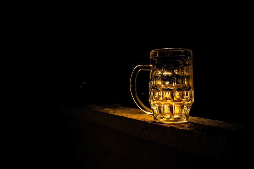 Picture of a pint of beer on a bar.